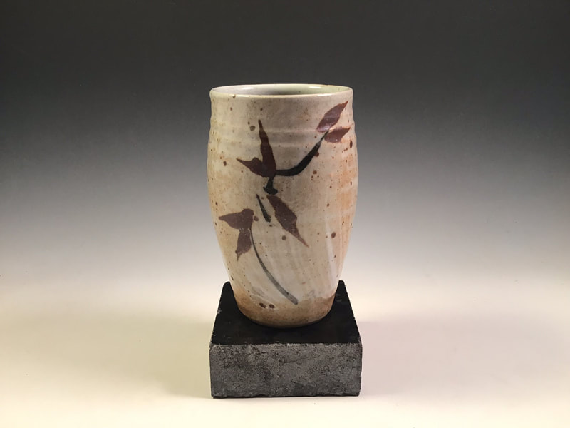 Cylindrical, hakeme, iron oxide decorated vase. Cone10, propane reduction. Signed 
$68 includes shipping to L48.
Contact Simon at: simonleachpottery@gmail.com
