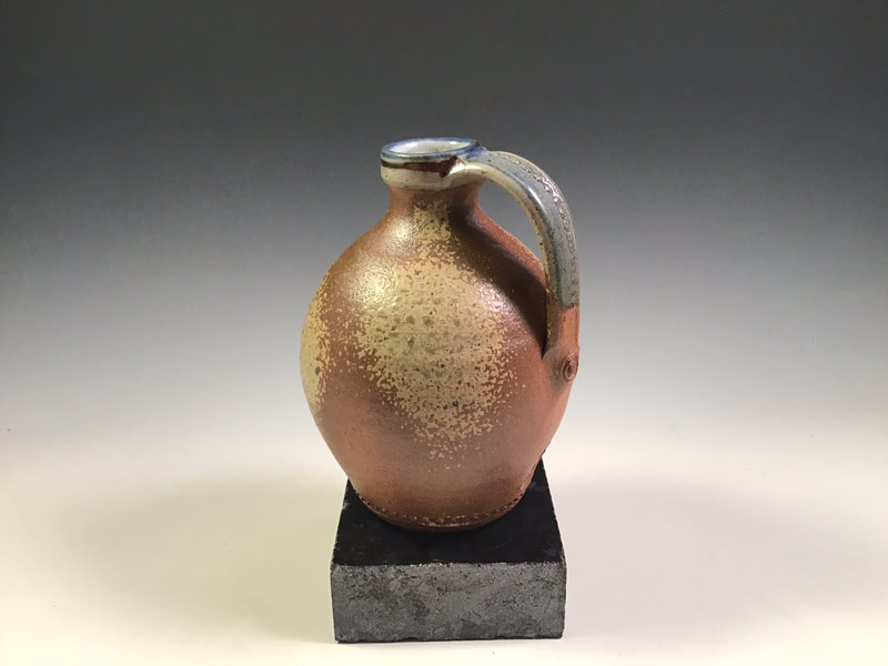 Strap bottle, wood ash spray, impressed handle, cone 10 in propane reduction. Signed.
$68 includes shipping to L48.
Contact Simon at: simonleachpottery@gmail.com