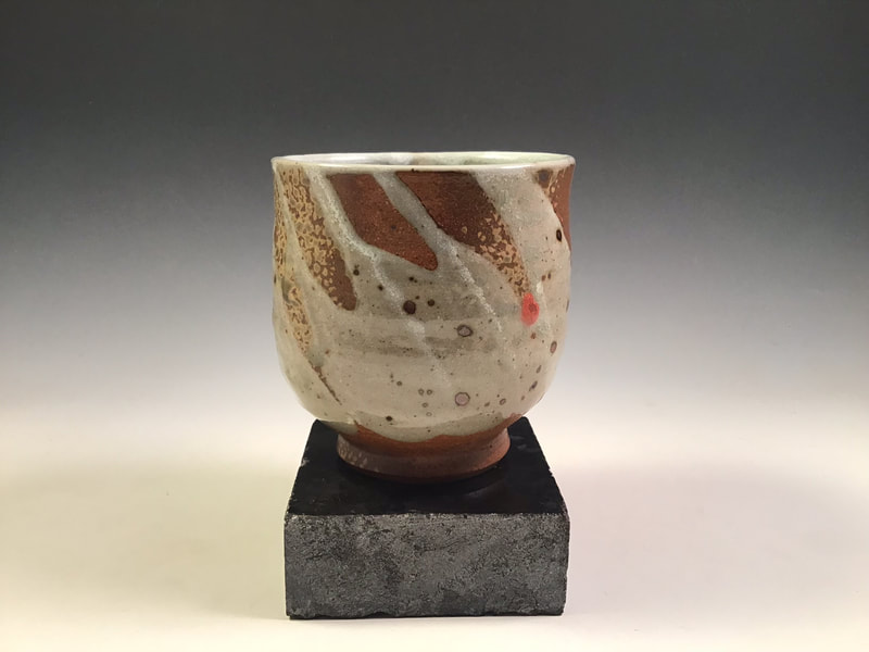 Tea bowl with trailed glaze decoration and wood ash spray, signed, cone 10 in propane reduction. Signed. $68 includes shipping to L48.
Contact Simon at: simonleachpottery@gmail.com