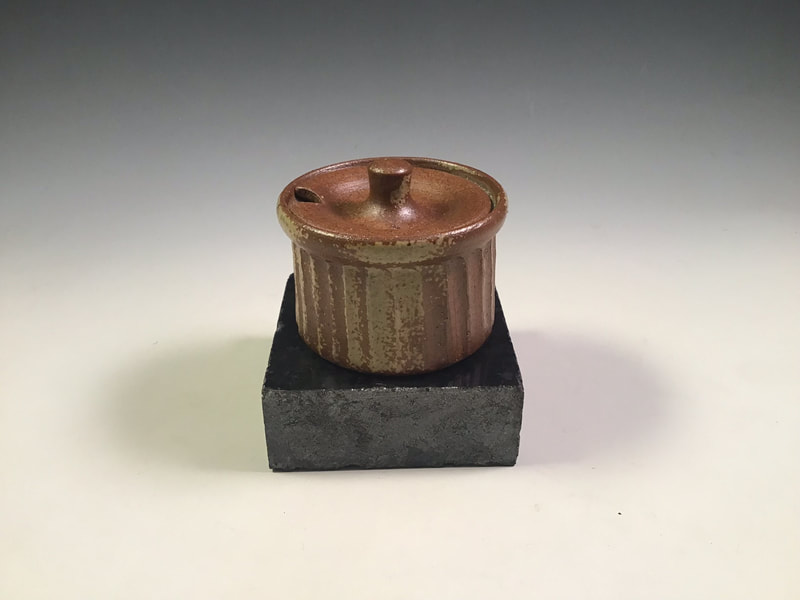 Small fluted mustard pot, wood ash sprayed. Signed. $45 includes shipping to L48. Contact Simon at: simonleachpottery@gmail.com